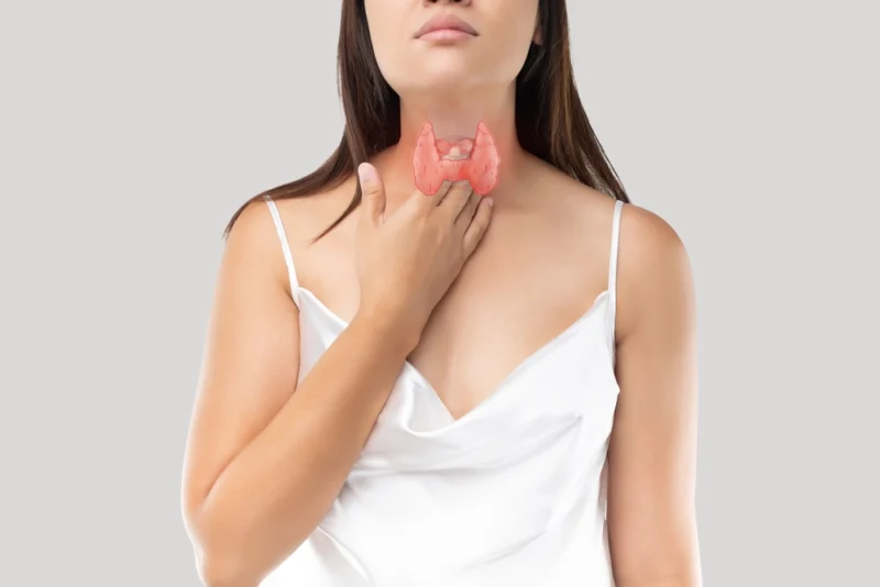 woman showing her Thyroid