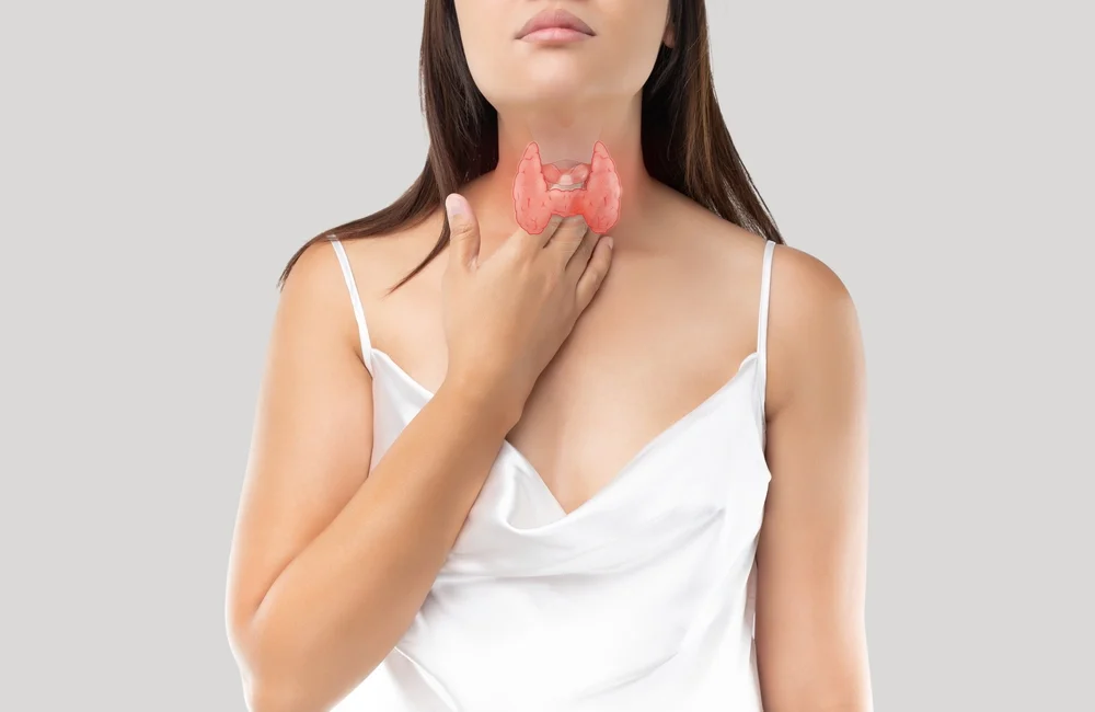 woman showing her Thyroid